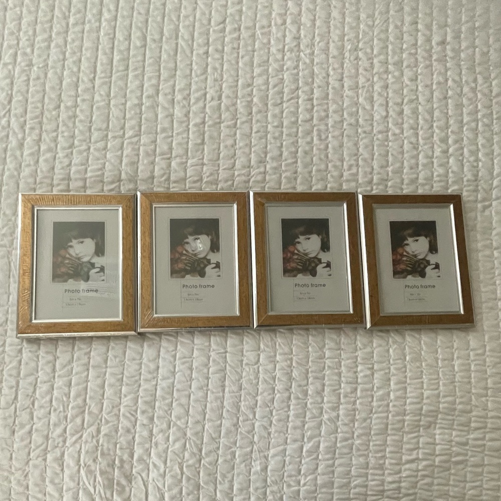 4 pieces Photo Frsmes 5”x7” gold silver